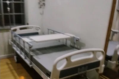 A 2-function hospital bed set up in a customer's bedroom in Malaysia