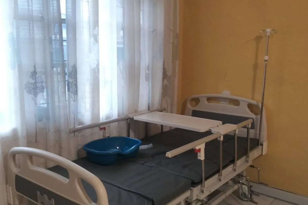 Hospital bed being prepared during an actual equipment delivery