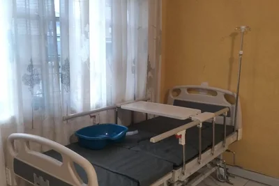 A hospital bed installed beside a window in a customer's home
